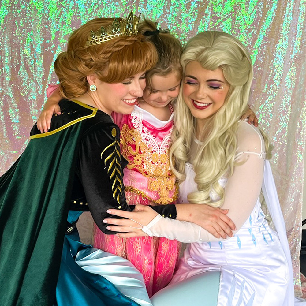 photo op at birthday party with two princesses