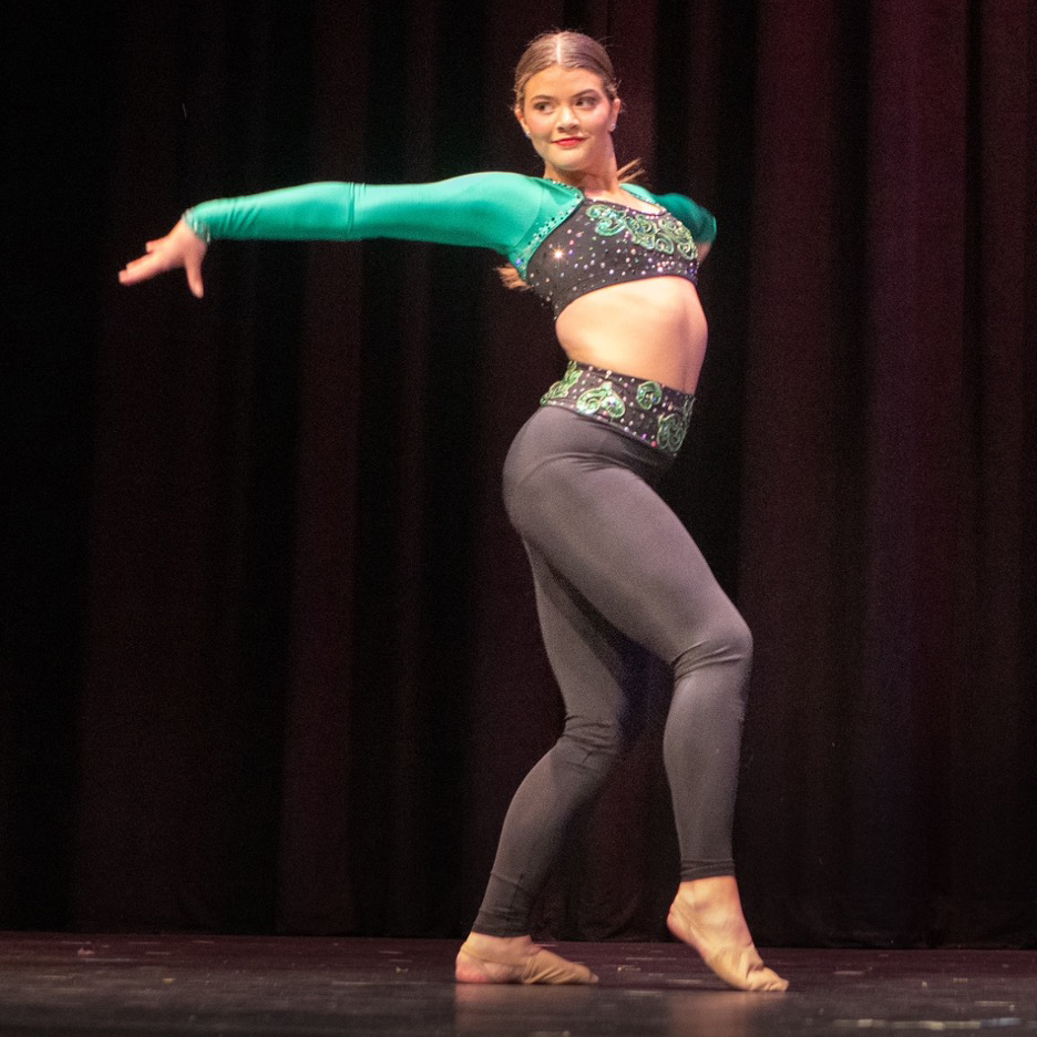 Woman dancing in recital.