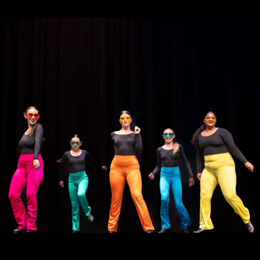 Five tap dancers in bright colored leotards